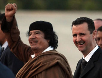 Libyan dictator Colonel Muammar al-Gaddafi with Syrian dictator President Bashar al-Assad, both responsible for executing tens of thousands of their own citizens