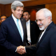 U.S. Secretary of State John Kerry shakes hands with Iranian Foreign Minister Mohammad Javad Zarif who seems to be finding something humorous which Kerry has missed completely