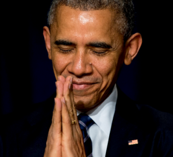 President Obama bows his head toward the Dalai Lama as he was recognized during the 2015 National Prayer Breakfast